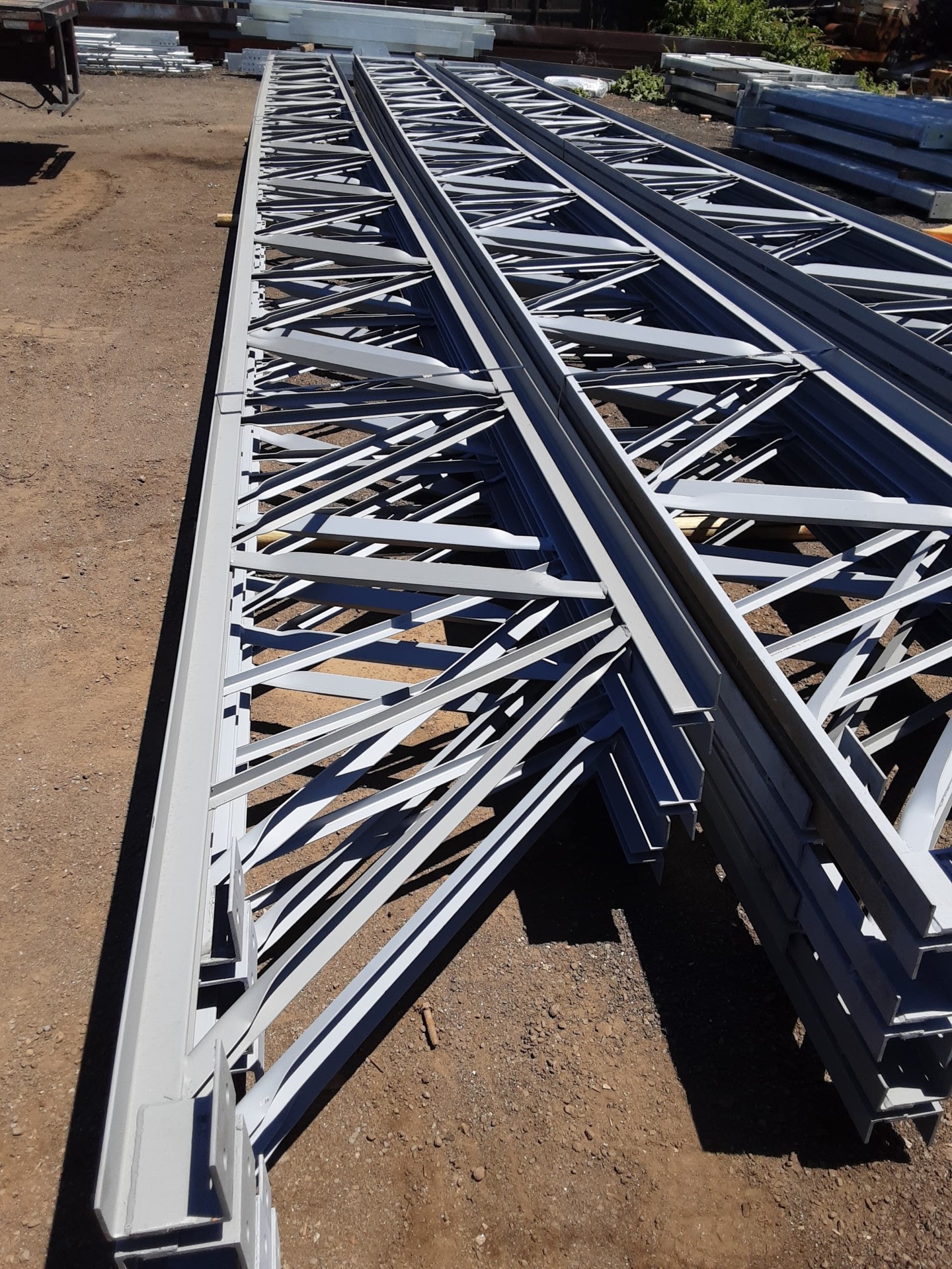 Painted steel joists fabricated by American Joist Company, ready for delivery